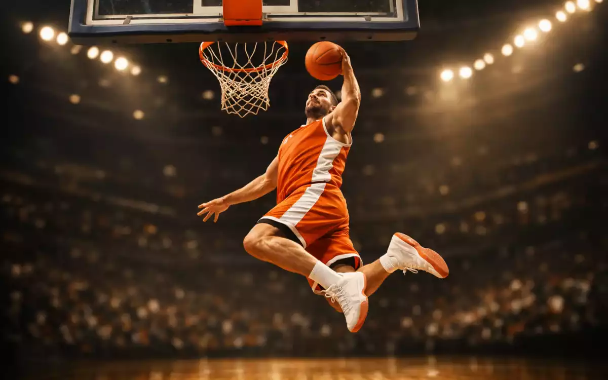 Giocatore di basket durante un tiro a canestro in una partita di pallacanestro